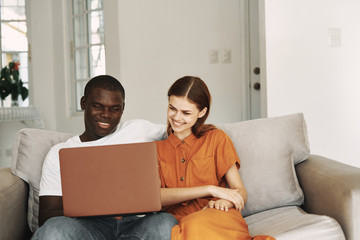 couple using laptop at home