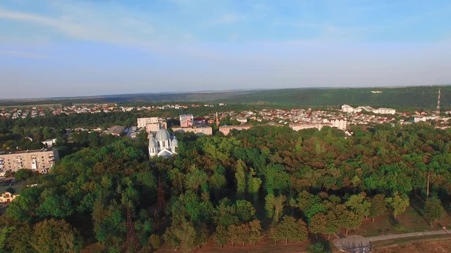 Golden Domes Of Cathedral, Aerial View. Faith Concept. Video From The Drone Where We Are Heading From The Canyon To The Top Where Is The Small Town And The Forest Where Is The Church Stay