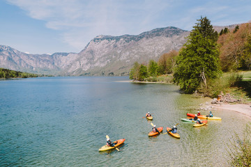 kayaking lake group of people. a group of kayaks on lake