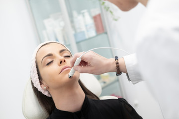 A girl getting facial and beauty care in a beauty clinic