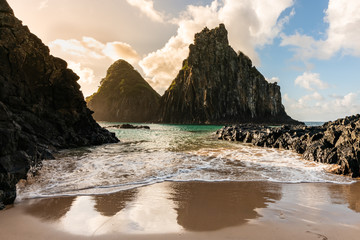 Beautiful Sunset at Cacimba do Padre beach with the view of Dois Irmaos Hill and turquoise clear...