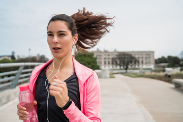 Portrait of fitness woman running.