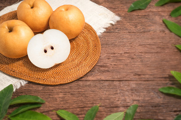 Snow pear or Korean pear on a wooden background, Nashi pear fruits delicious and sweet on wooden background