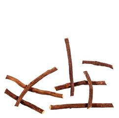 Heap of licorice sticks on white background - Glycyrrhiza glabra