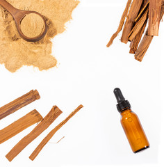 Medicinal drops of Uncaria tomentosa on white background