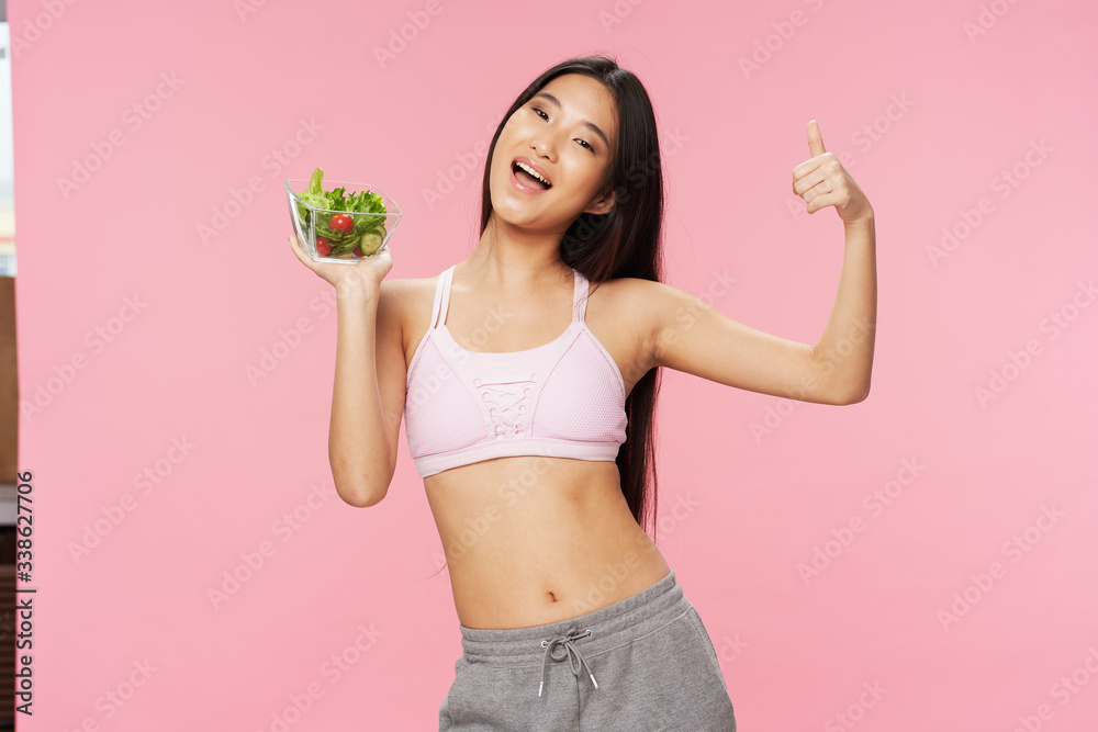 Sticker young woman holding a weight scale and smiling