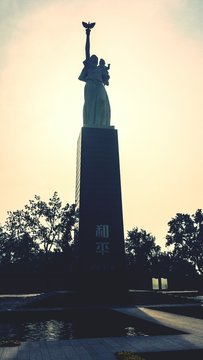 Peace Statue At Nanjing Massacre Memorial Hall Against Sky