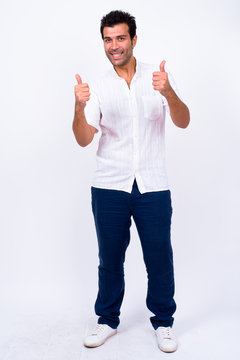 Full Body Shot Of Happy Handsome Turkish Man Giving Thumbs Up