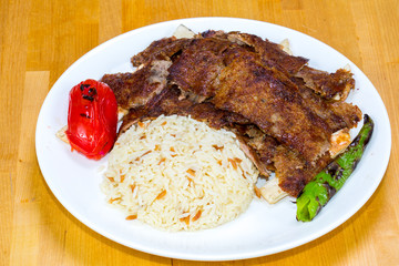 Gyro kebab with salad and rice on plate 