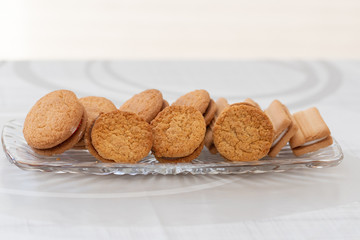 A selection of biscuits / cookies on a glass tray
