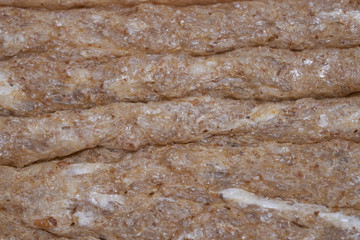 Wheat and rye bread slice texture, food macro, closeup.  