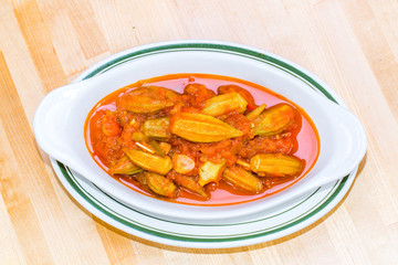 Stewed Okra Casserole with tomato sauce close up 