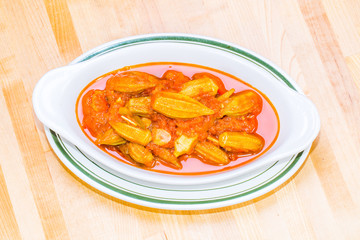Stewed Okra Casserole with tomato sauce close up 