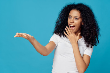 young woman with finger on lips