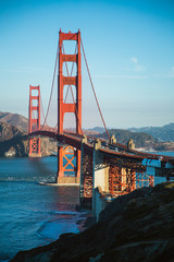 The famous Golden Gate Bridge in San Francisco, California. Beautiful sunlight hitting the bridge as cars drive over it.  © Sky Perth