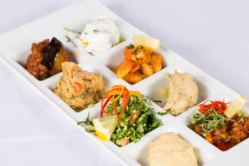 A variety of Appetizer inside scoop with Oil	