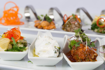 A variety ofAppetizer inside scoop with Oil