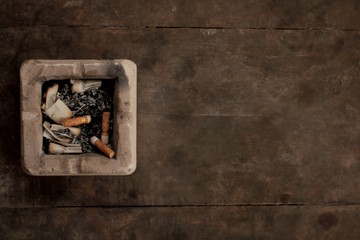 cigarette on old brown table