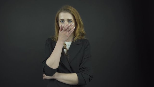 attractive lady in black jacket performs emotions of sadness