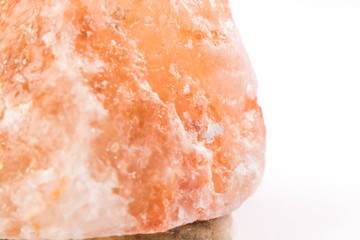 Himalayan salt lamp up close macro photography - White background.