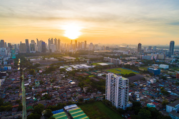 Obraz premium Bangkok downtown city office building with green park sunset aerial view