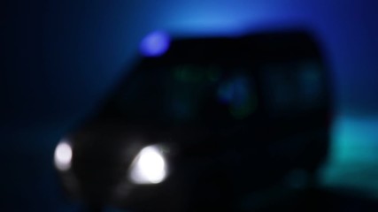 Corona virus concept with Ambulance car. Stay home for precautionary measures to prevent from corona virus. Ambulance car on dark misty background. Creative artwork decoration. Selective focus