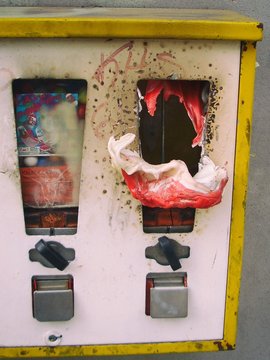 Broken Gumball Machine On Wall