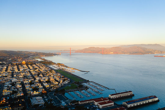Drone image of the sunrise light-hitting San Francisco city. 