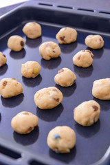 Baking tray with uncooked cookies, closeup