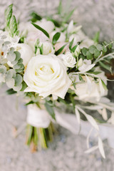 Obraz na płótnie Canvas wedding bouquet with white roses for rustic wedding