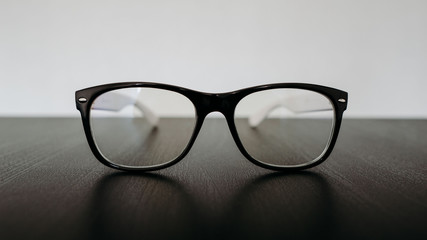 glasses on black background. hipster glasses on a black table. glasses for vision. Computer glasses