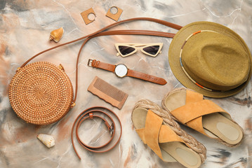 Summer composition with stylish accessories on color background