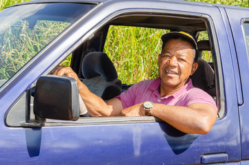 Man In Blue Pickup Truck - Powered by Adobe
