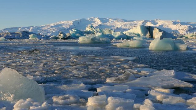 Global warming climate change iceberg floe broken from glacier melting in water