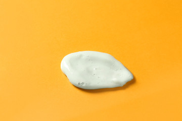 Shower gel on color background