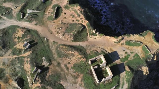 Aerial top down forward view of old fortification along Portuguese coast