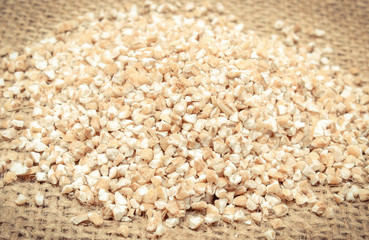Barley groats as source minerals and fiber on jute burlap