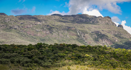 Impressive mountain scenery with shadows, blue sky and clouds, Caraca natural park, Minas Gerais, Brazil
