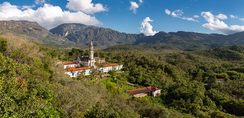 Panoramic aerial view of Sanctuary Cara&ccedil;a with mountains and blue sky in background, Minas Gerais, Brazil
