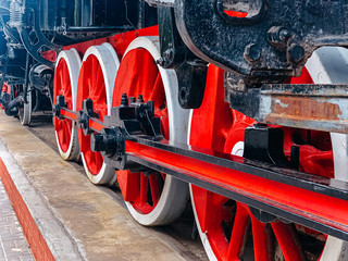 brake system iron wheels of stream engine locomotive train on railways track forward use for old and classic period land transport and retro vintage style background