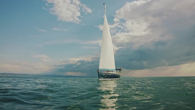 Sailboat on a cloudy horizon