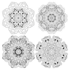 Hand drawn zentangle set of 4 mandalas for coloring page.