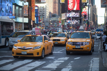 Fototapeta na wymiar Yellow Taxies On City Street