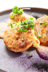 Fishcakes with garden cress closeup view view