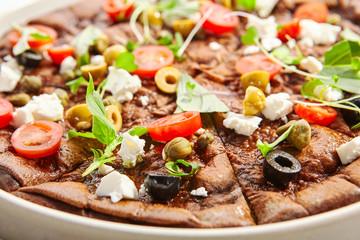 Borodino foccacia with tomatoes, olives and cheese