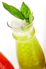 Kiwi and basil lemonade glass close up
