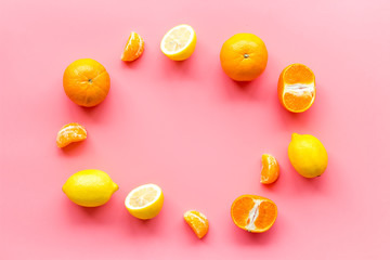 Colorful summer fruits frame on pink background top view copy space