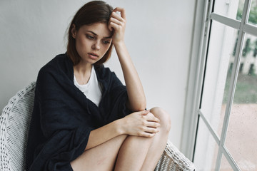 young woman sitting on the chair