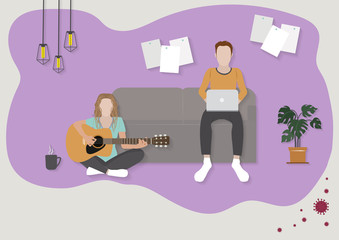 Young man work with a laptop sitting on Sofa and young women relaxing playing the guitar on floor at home.