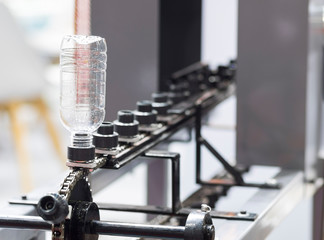 a platic bottle in shrink label machine ;